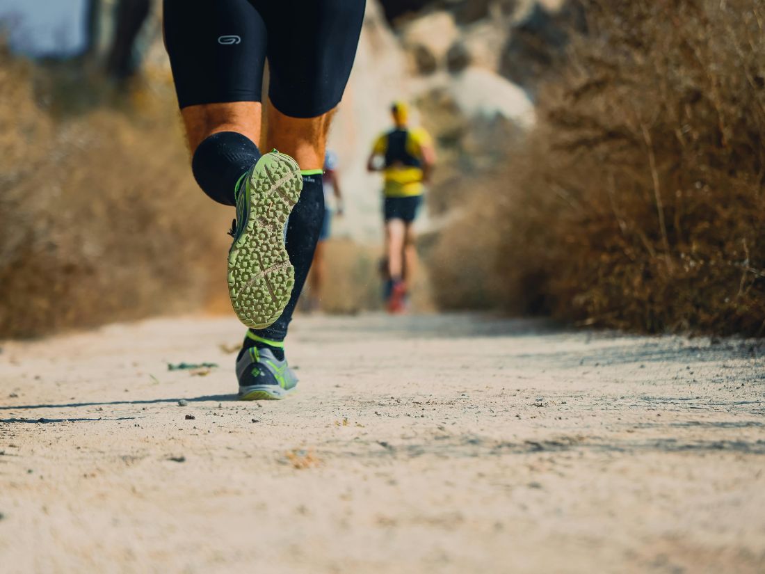 Trail runner on a dirt path used as inspiration for fake Strava generator runs, SimuRun fake Strava generator.